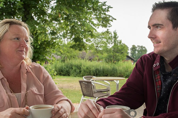 Two people drinking coffee